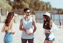 Friends playing volleyball on the beach