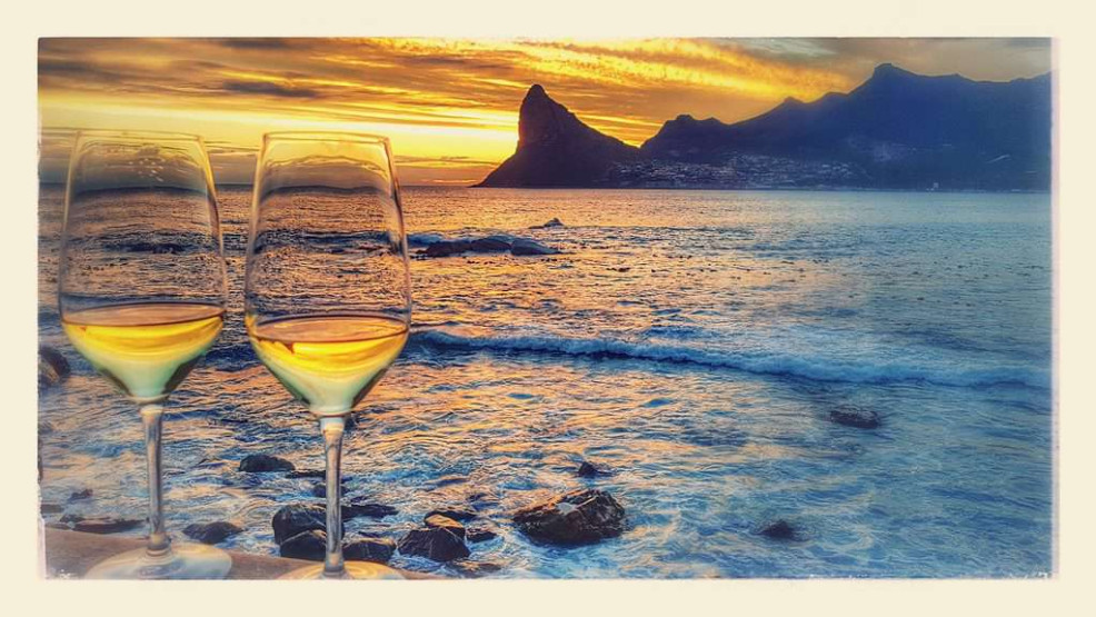 Enjoy a glass of wine at sunset at the Tintswalo Atlantic in Hout Bay, Cape Town, South Africa